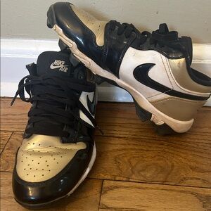 Nike Air Black and Metallic Gold baseball cleats size 6Y